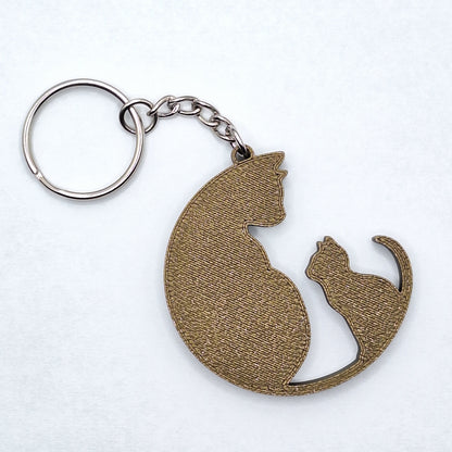 Handmade and customizable cat and kitten keychains in bronze, perfect for pet parents, gift sets and animal rescues.