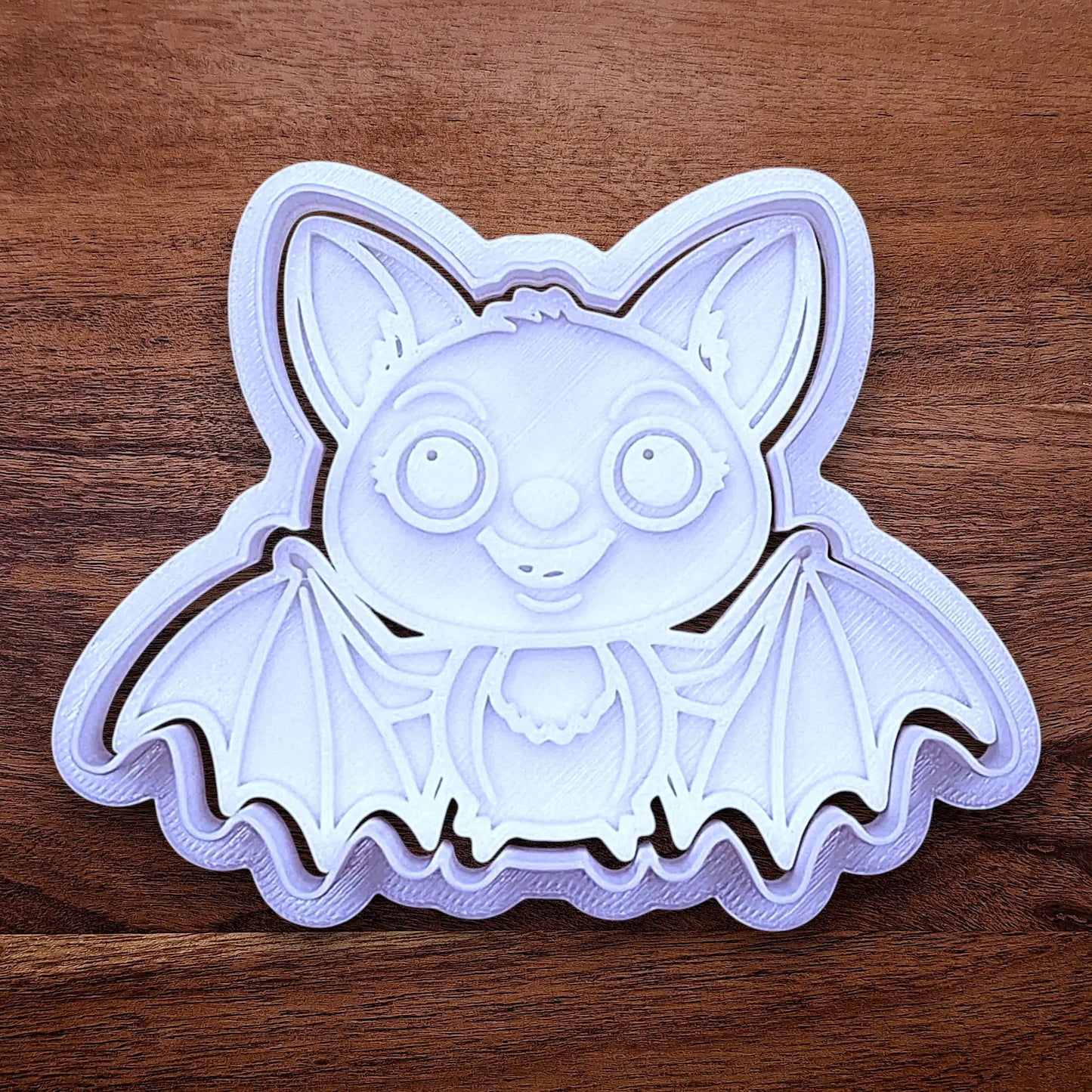 Cute bat cookie cutter with stamp - adds cute Halloween charm. Complete with cute details for whimsical baking, parties, or spooky gifting. Handmade and customizable in 30 colors.