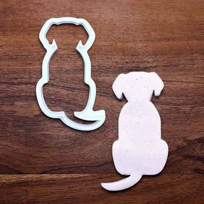 Dog-shaped cookie cutter alongside a dough cutout, perfect for pet-themed treats, parties, or homemade dog cookies – eco-friendly and handmade.