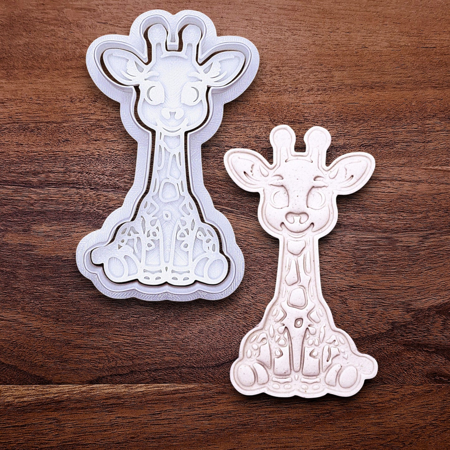 Giraffe cookie cutter with matching stamp. Creates cute safari cookies or fondant toppers with charming animal detail.