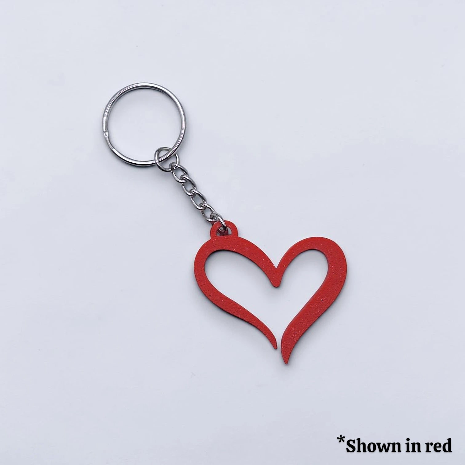 Handmade and customizable heart keychain in red, perfect for Valentine's Day, party favors, baby showers, or everyday gifts.