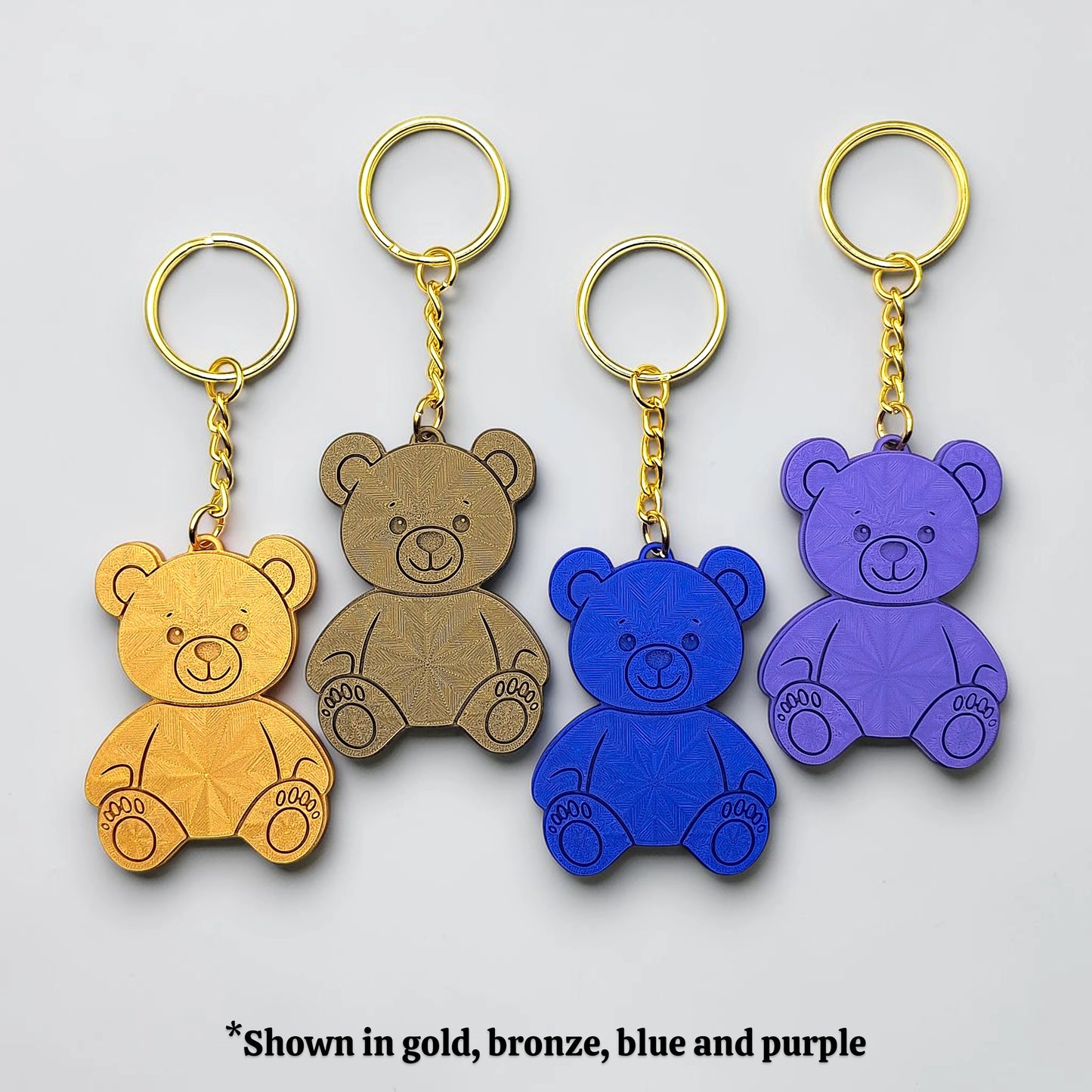 Colorful teddy bear keychains in various colors - handmade eco-friendly charms perfect for kids, baby showers, party favors, or animal-themed gifts.