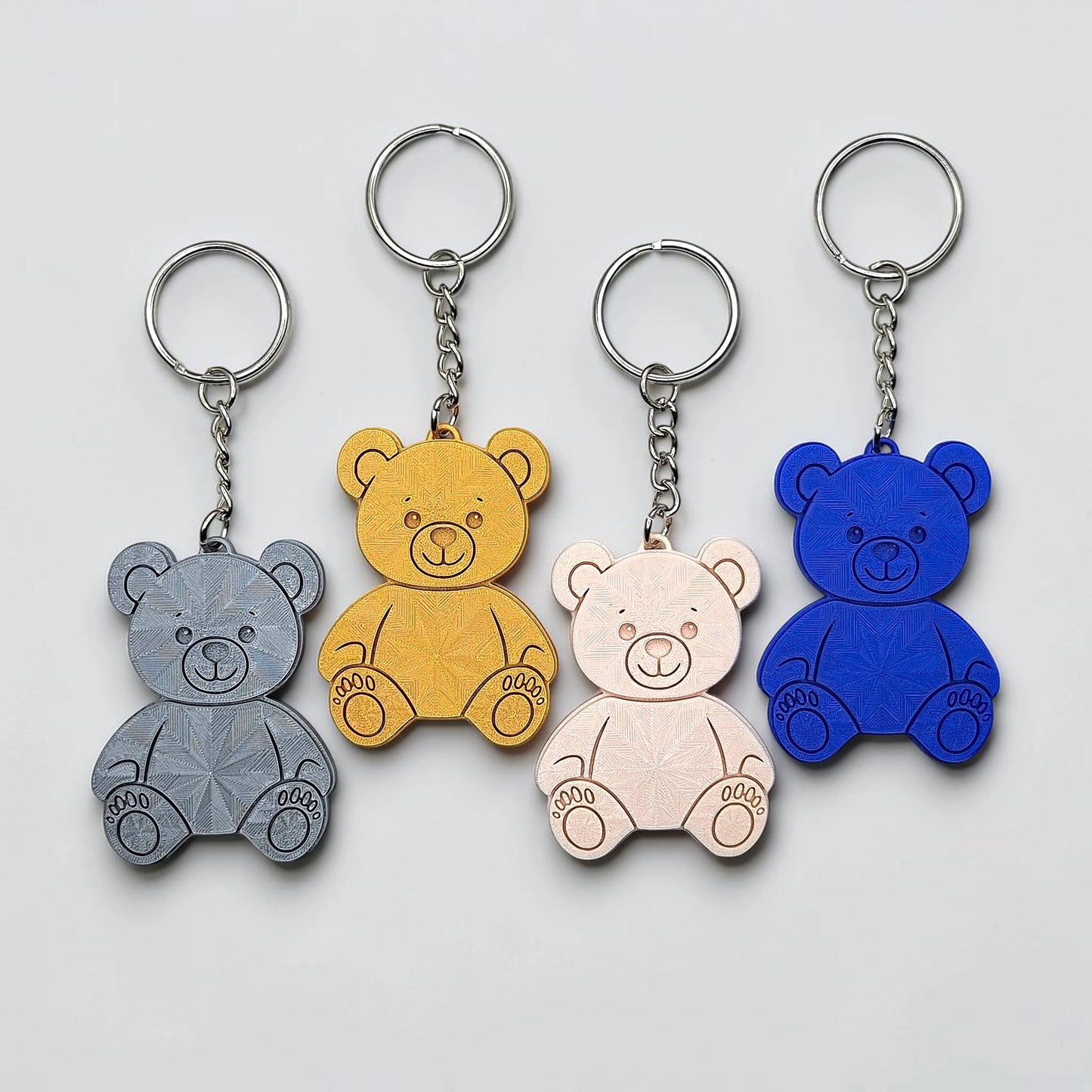Teddy bear keychains in multiple colors - eco-friendly charms perfect for kids, baby showers, party favors, or animal-themed gifts.