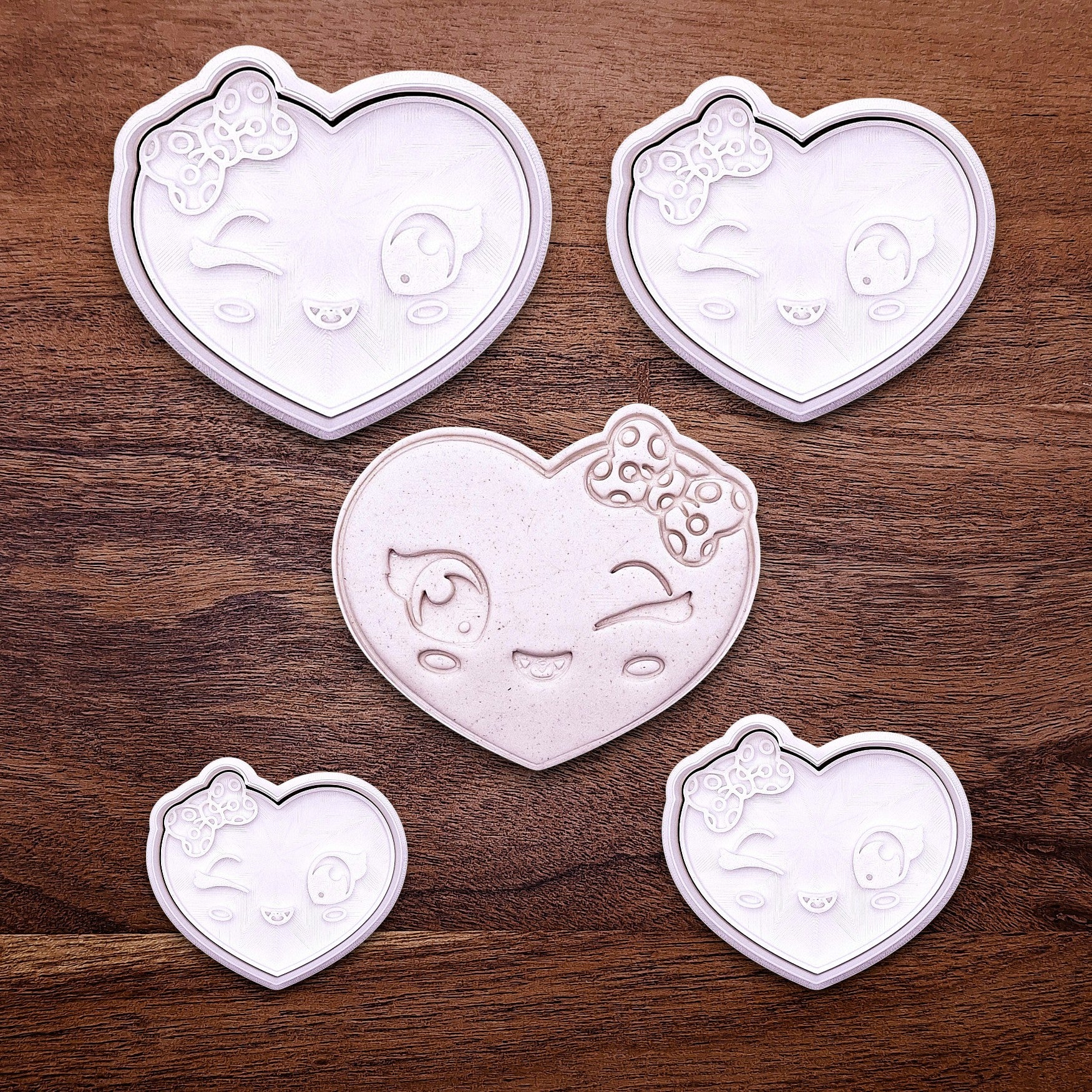 Heart cookie cutters and stamps with girly face imprint, perfect for Valentine’s Day cookies, weddings, parties, fondant, and fun DIY baking projects.
