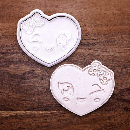 Heart cookie cutter and stamp with girly face imprint, perfect for Valentine’s Day cookies, weddings, parties, fondant, and fun DIY baking projects.
