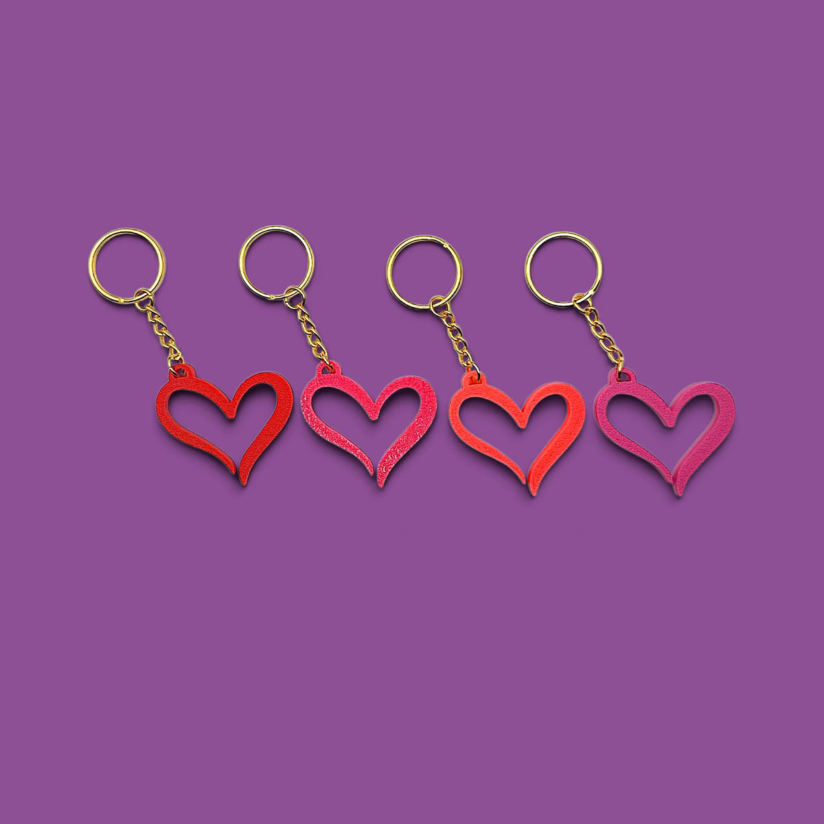 Handmade and customizable heart keychains with gold keyring, perfect for Valentine's Day, party favors, baby showers, or everyday gifts.