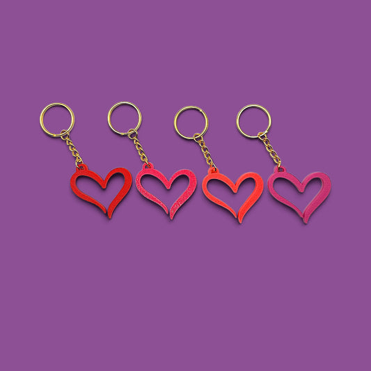 Handmade and customizable heart keychains with gold keyring, perfect for Valentine's Day, party favors, baby showers, or everyday gifts.
