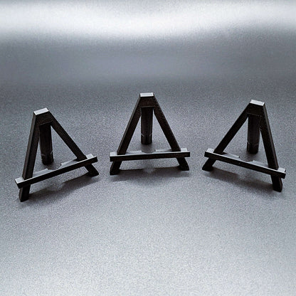 Mini foldable easels in black – compact and portable display stands, perfect for showcasing coins, trading cards, art, photos, or products at craft fairs, markets, and retail displays.