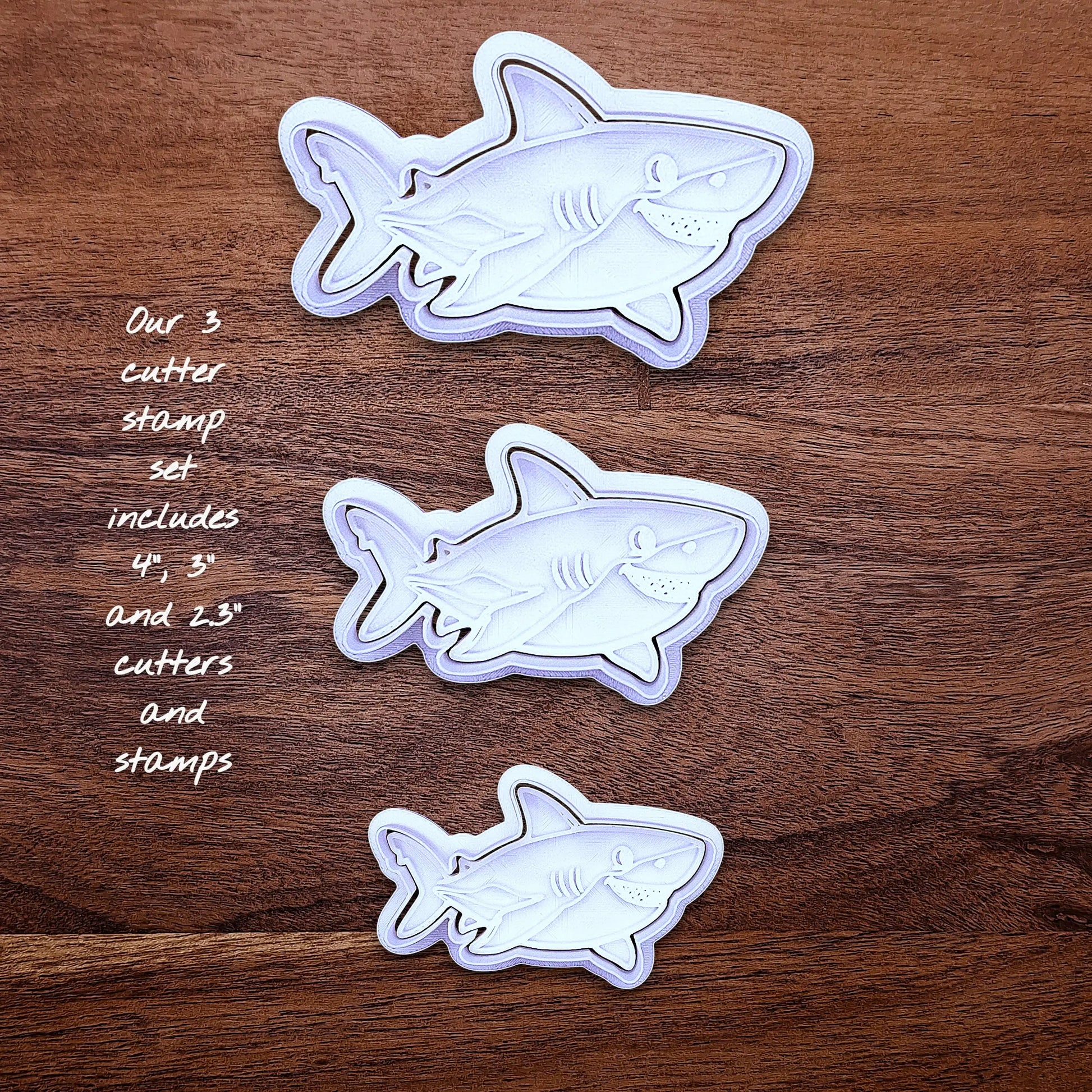 Set of smiling shark cutters and stamps. Ideal for baking cute shark cookies for kids’ birthdays, beach days, or sea-themed events.