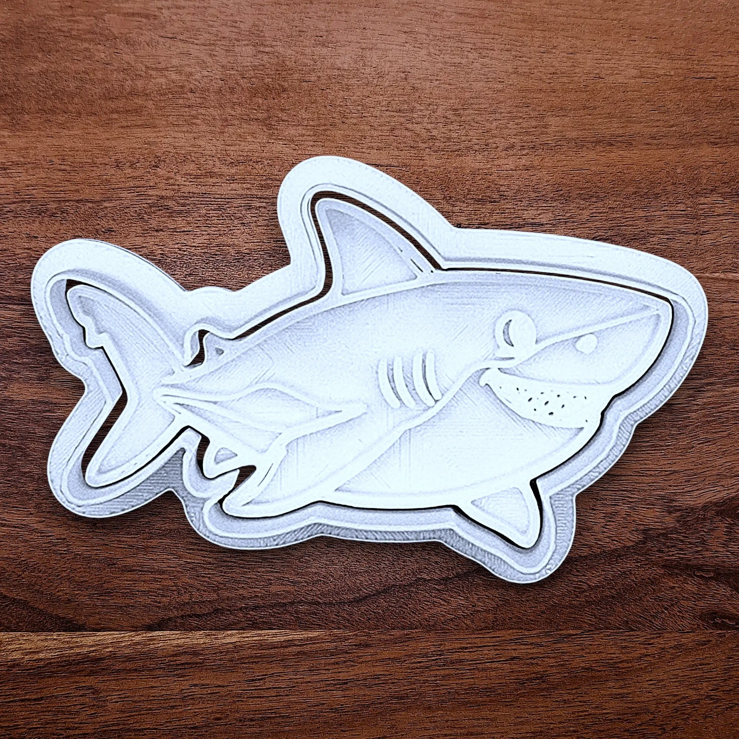 Customizable ocean shark cookie cutter and stamp, creates standout ocean cookies with charming face and fin details, perfect for themed birthdays, baby showers, and beach parties.