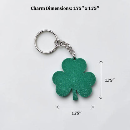 Handmade and customizable shamrock keychain in mistletoe green alongside dimensions, perfect for St Patrick's Day party favors and gifts.