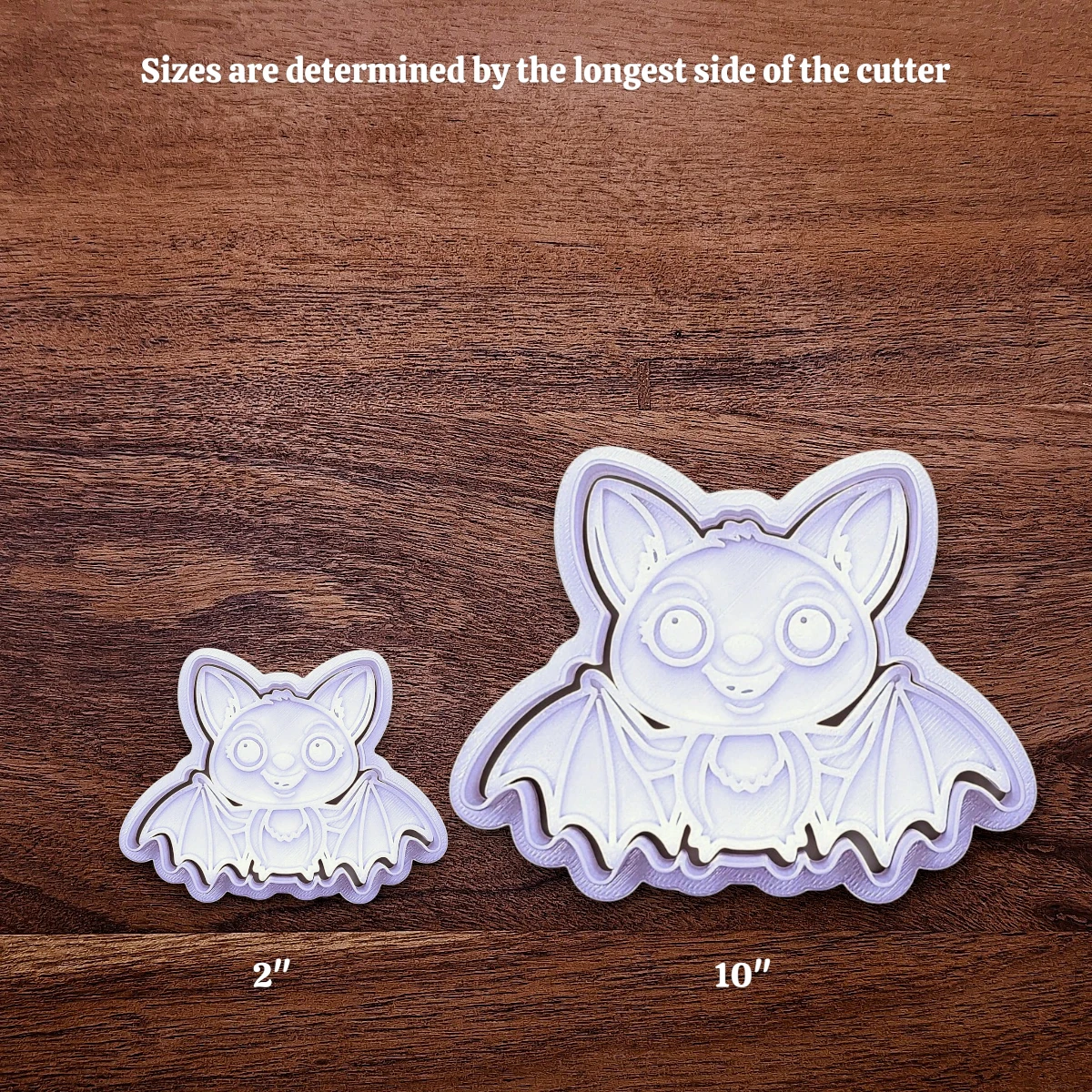 Sizing guide for the girly bat cookie cutter and stamp showing how increasing the size works.