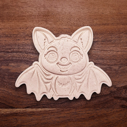 Stamped cute bat cookie dough with cute details from cutter and stamp set—perfect for cute and spooky Halloween bakes without the need for piping.