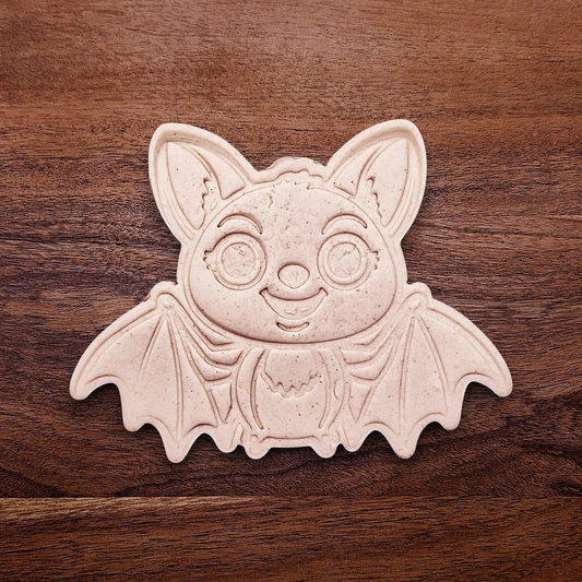 Stamped cute bat cookie dough with cute details from cutter and stamp set—perfect for cute and spooky Halloween bakes without the need for piping.