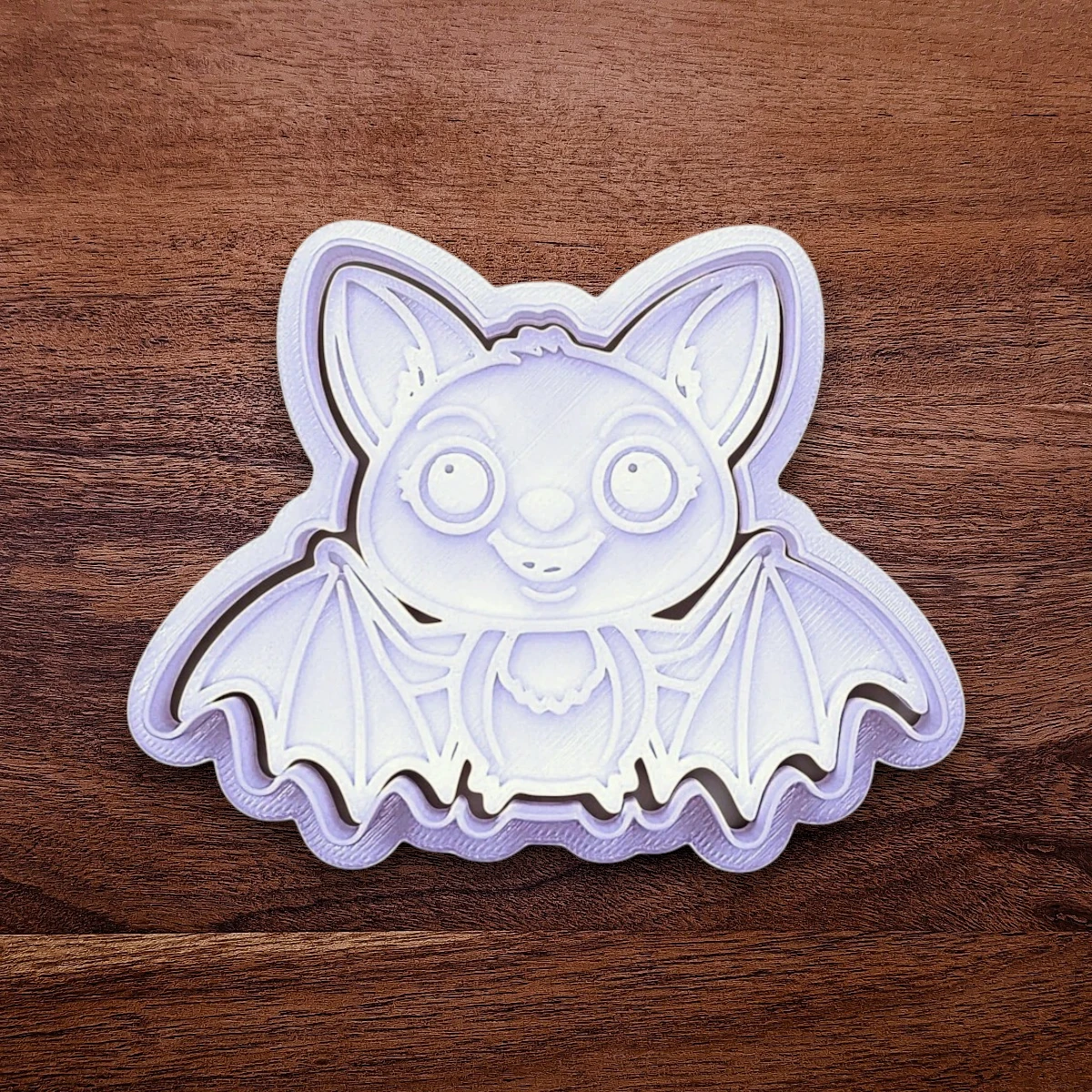 Cute bat cookie cutter with stamp - adds cute Halloween charm. Complete with cute details for whimsical baking, parties, or spooky gifting. Handmade and customizable in 30 colors.