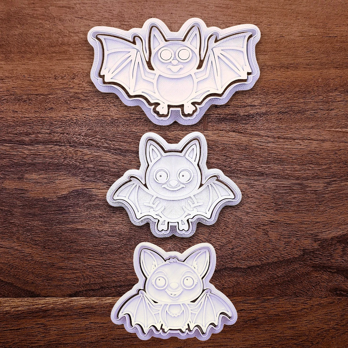 Bat cookie cutters and stamps, perfect for Halloween treats, fall party favors, and gifting. Customizable in 30 unique colors and made from eco-friendly materials.