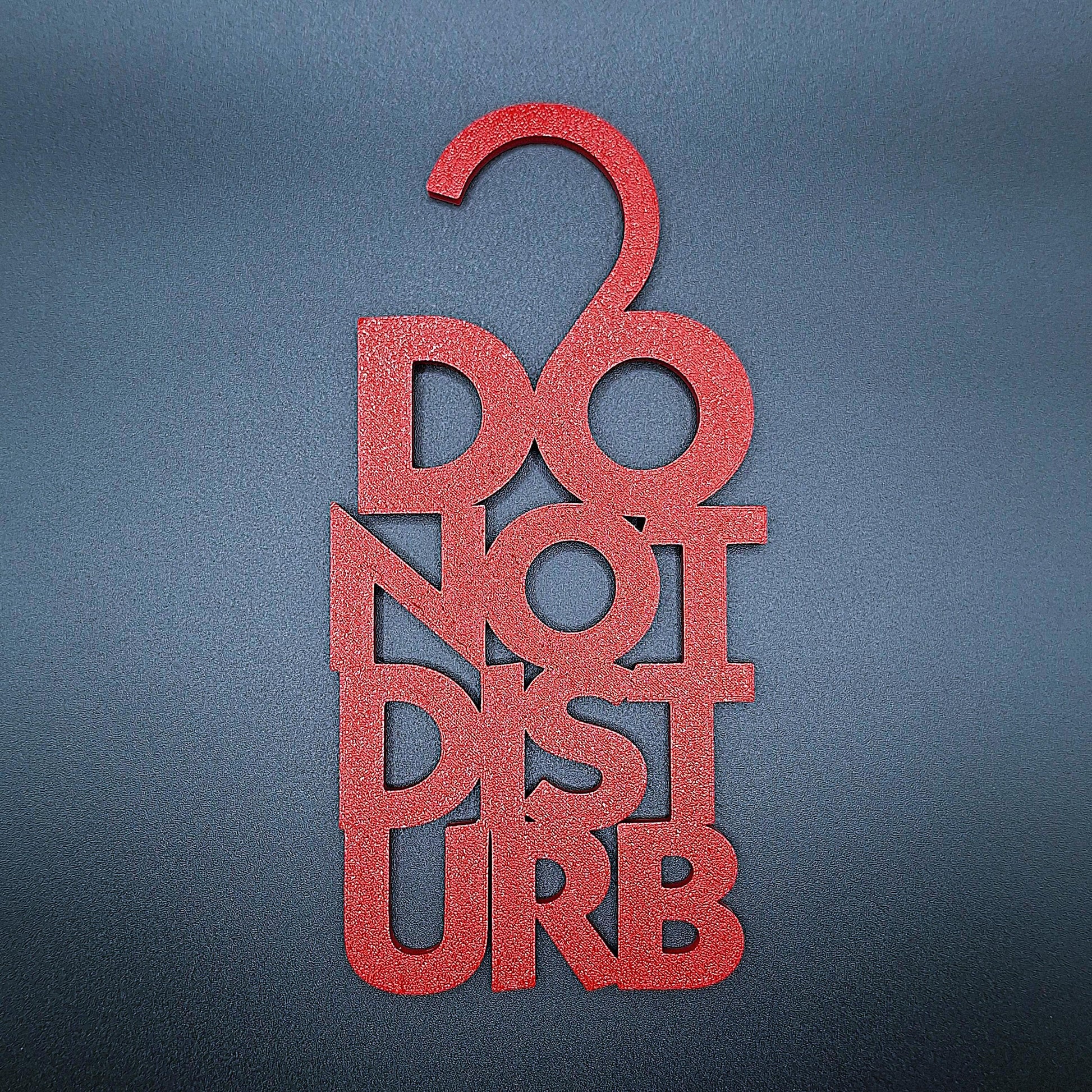 Maroon red Do Not Disturb sign with white bold lettering, ideal for hotel rooms, office spaces, and personal areas needing uninterrupted privacy.