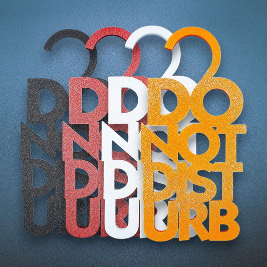 Four Do Not Disturb hangers with clean, modern text—perfect minimalist sign for professional or personal use to block unwanted interruptions.