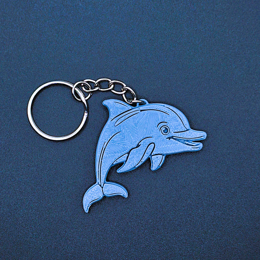 Front detail of dolphin keychain. Cute sea life charm for backpacks, eco-friendly PLA plastic, ideal marine animal gift or party favor.