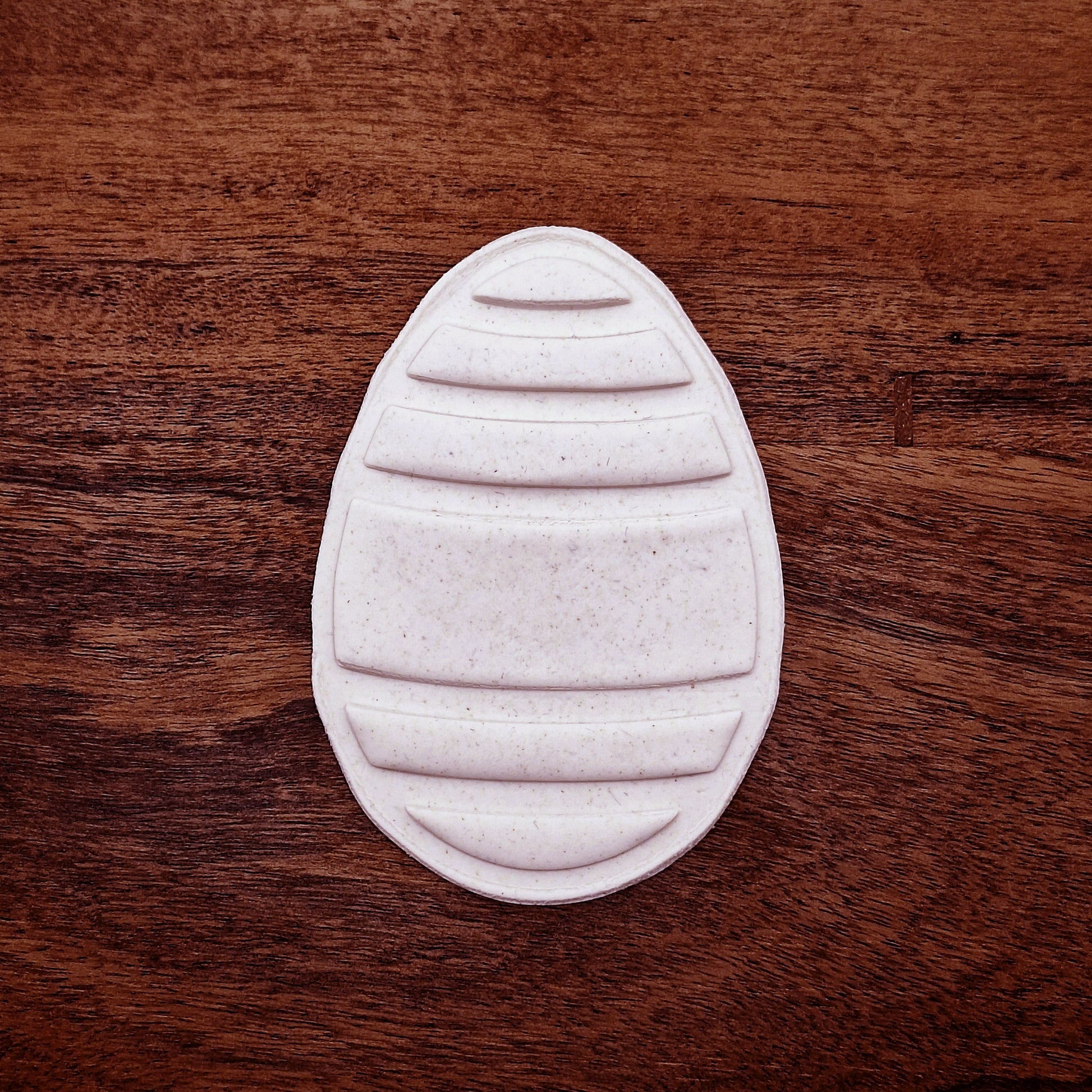 Easter egg dough imprint made with matching stamp—shows clean lines and festive design, ideal for no-fuss cookie decorating.