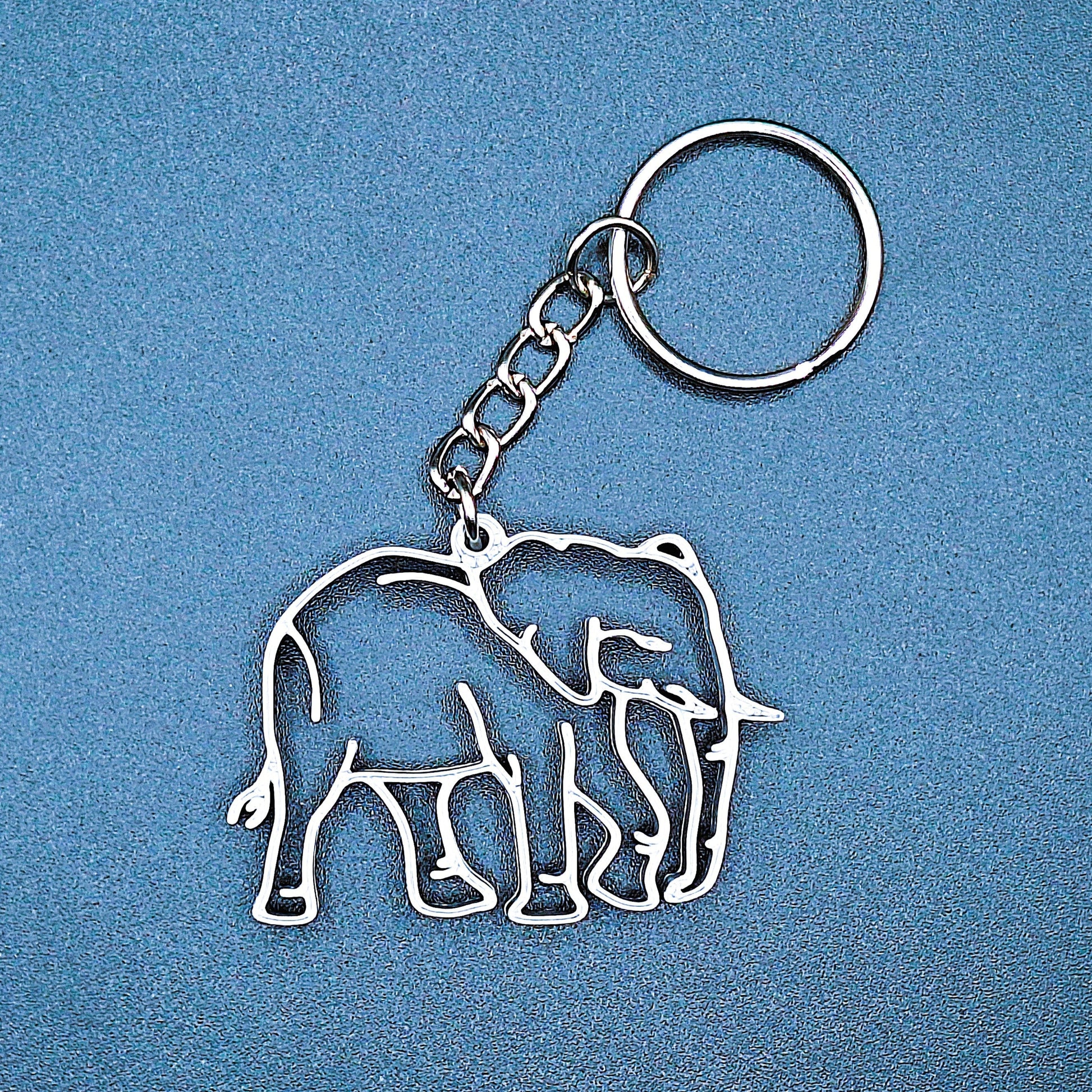 Elephant keychain, cute animal charm for backpacks, keys, or bags, perfect gift for animal lovers, collectors, and everyday accessories.