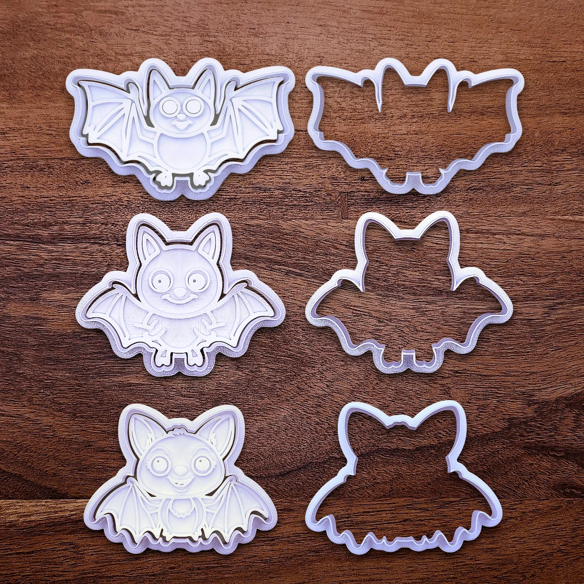 Bat cookie cutters and stamps, perfect for Halloween treats, fall party favors, and gifting. Customizable in 30 unique colors and made from eco-friendly materials.