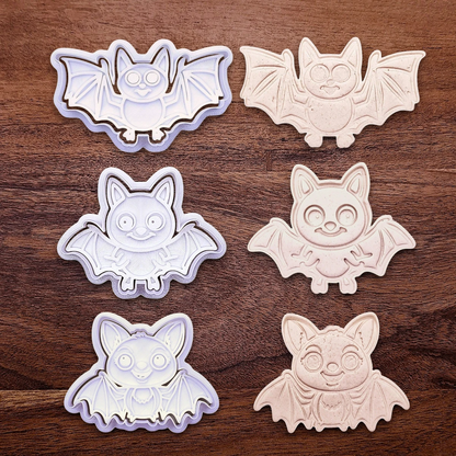 Bat cookie cutters and stamps alongside dough cutouts and imprints, perfect for Halloween treats, fall party favors, and gifting. Customizable in 30 unique colors and made from eco-friendly materials.