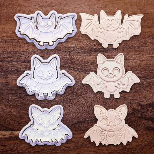 Bat cookie cutters and stamps alongside dough cutouts and imprints, perfect for Halloween treats, fall party favors, and gifting. Customizable in 30 unique colors and made from eco-friendly materials.