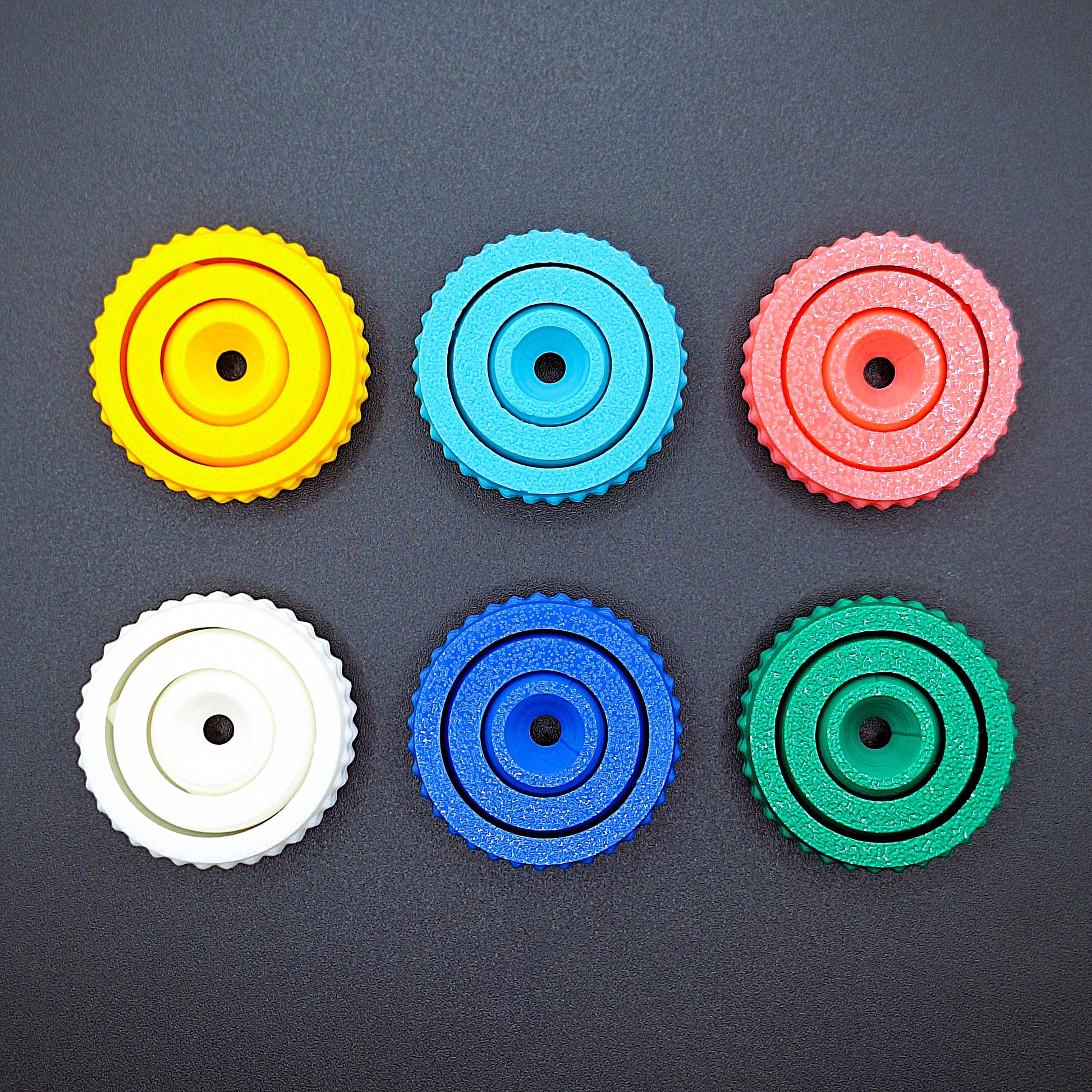 Six fidget gyro spinners with modern designs and smooth spin, handmade from eco PLA, great for stress relief, sensory play, and focus support.