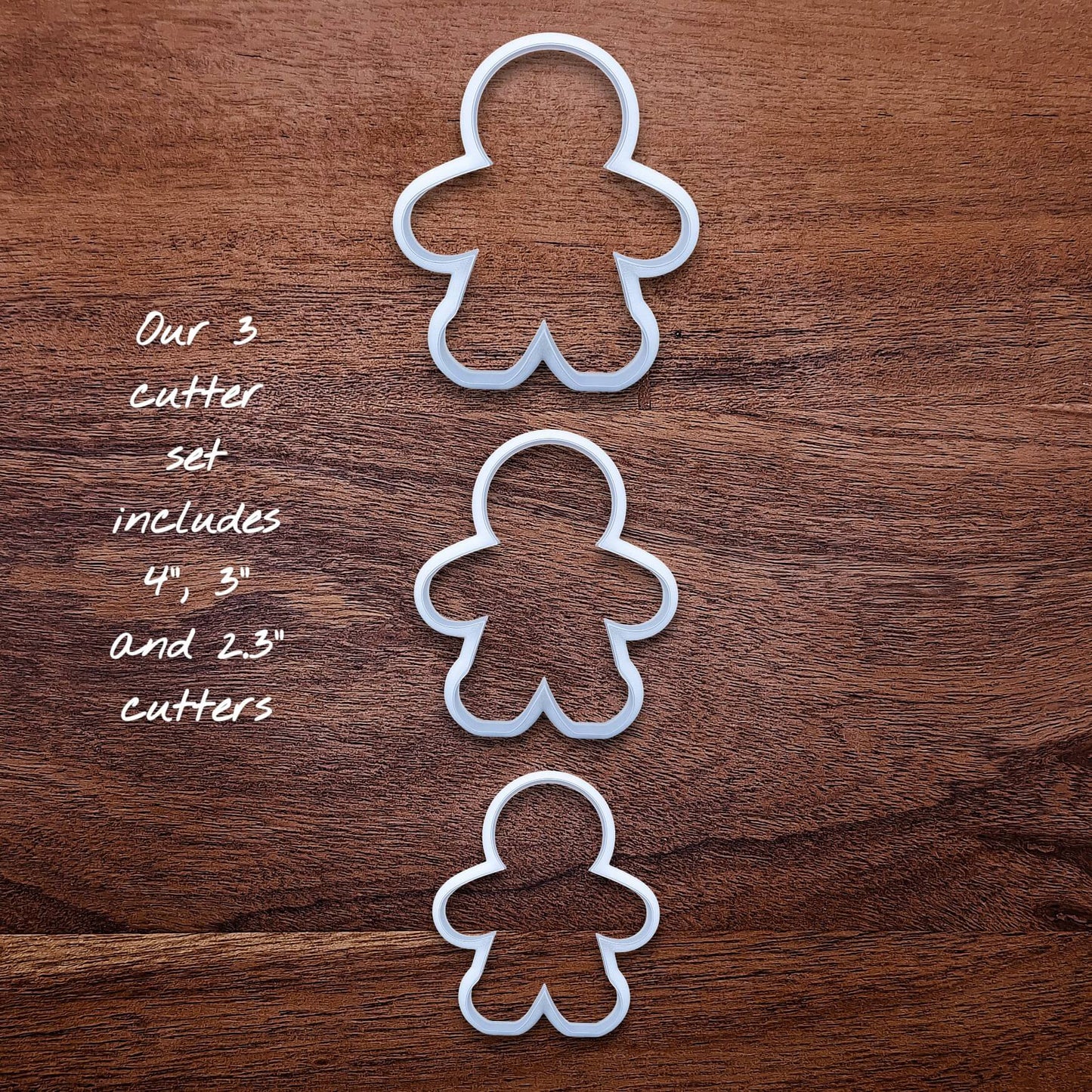 Gingerbread cookie cutter set for Christmas baking—includes three sizes and matching stamps to easily press in sweet festive details.