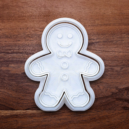 Holiday gingerbread man cookie cutter with matching stamp – add festive details easily to your Christmas cookies, fondant, or clay crafts.