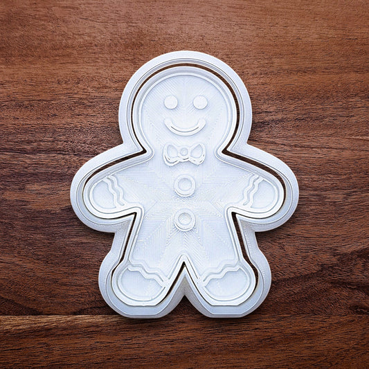 Holiday gingerbread man cookie cutter with matching stamp – add festive details easily to your Christmas cookies, fondant, or clay crafts.
