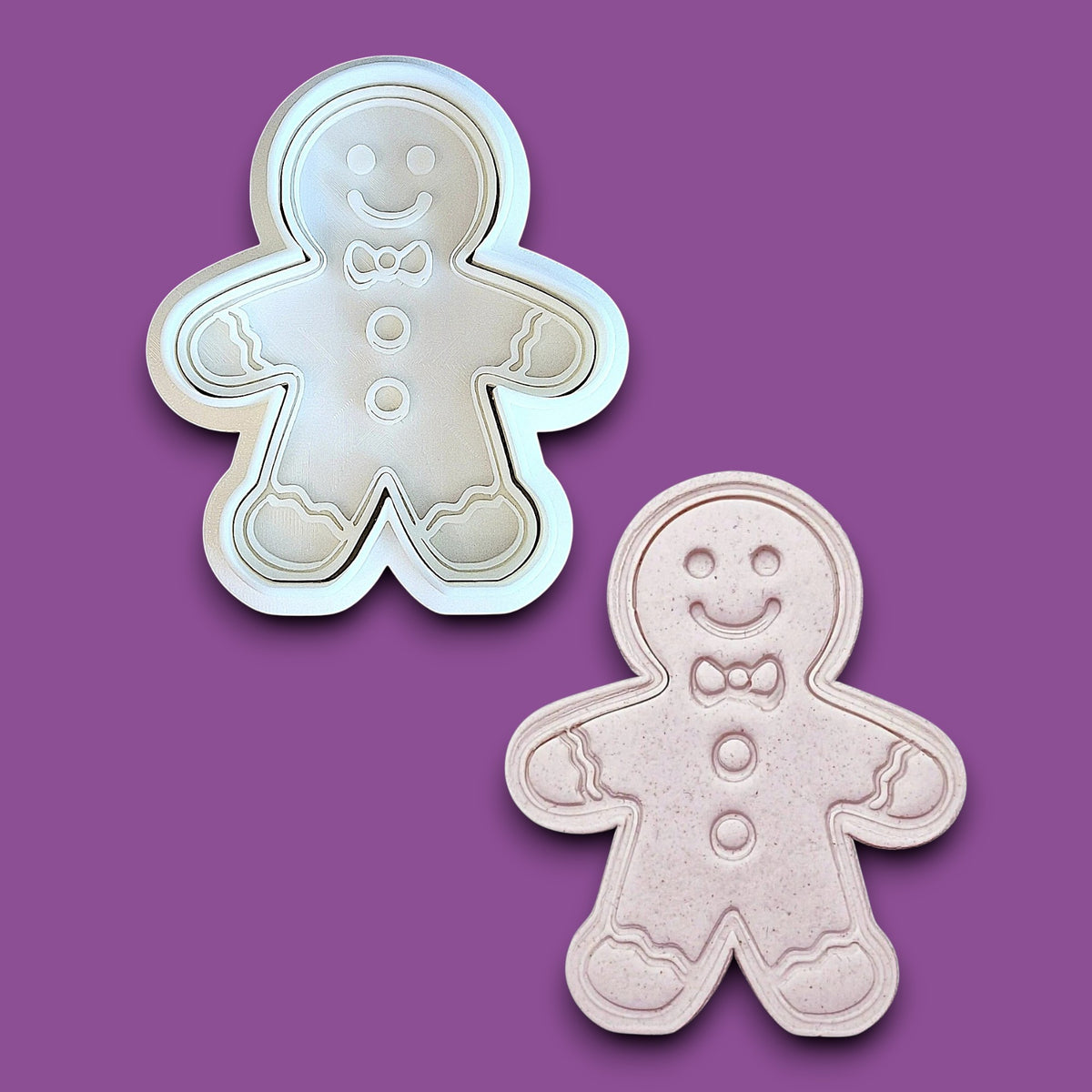 Holiday gingerbread man cookie cutter with matching stamp alongside a dough cutout and imprint – add festive details easily to your Christmas cookies, fondant, or clay crafts.