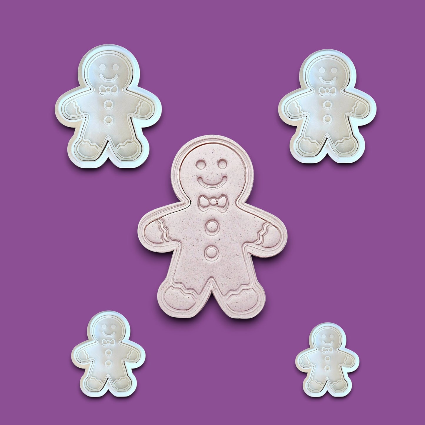 Holiday gingerbread man cookie cutters with matching stamps – add festive details easily to your Christmas cookies, fondant, or clay crafts.