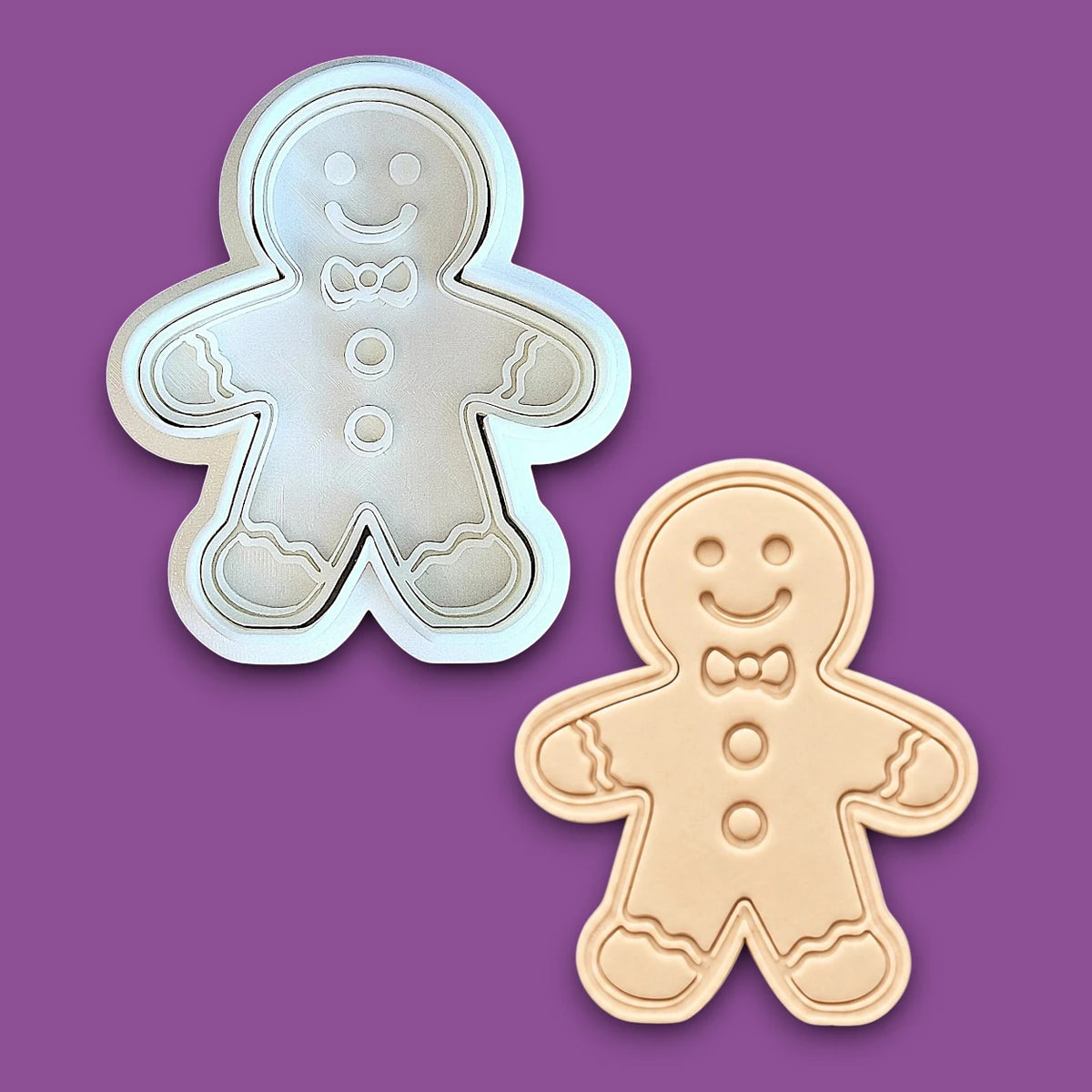Holiday gingerbread man cookie cutter with matching stamp alongside a dough cutout and imprint – add festive details easily to your Christmas cookies, fondant, or clay crafts.