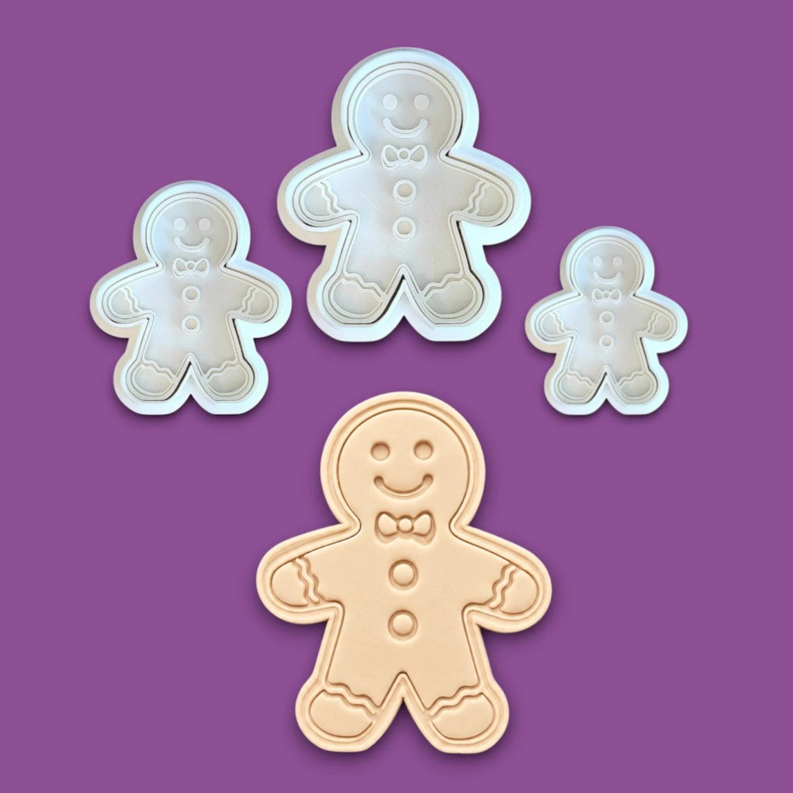 Holiday gingerbread man cookie cutters with matching stamps – add festive details easily to your Christmas cookies, fondant, or clay crafts.