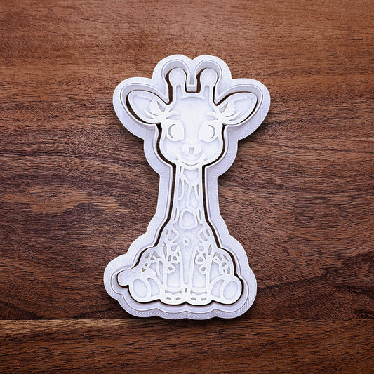 Giraffe cookie cutter with matching stamp. Creates cute safari cookies or fondant toppers with charming animal detail.