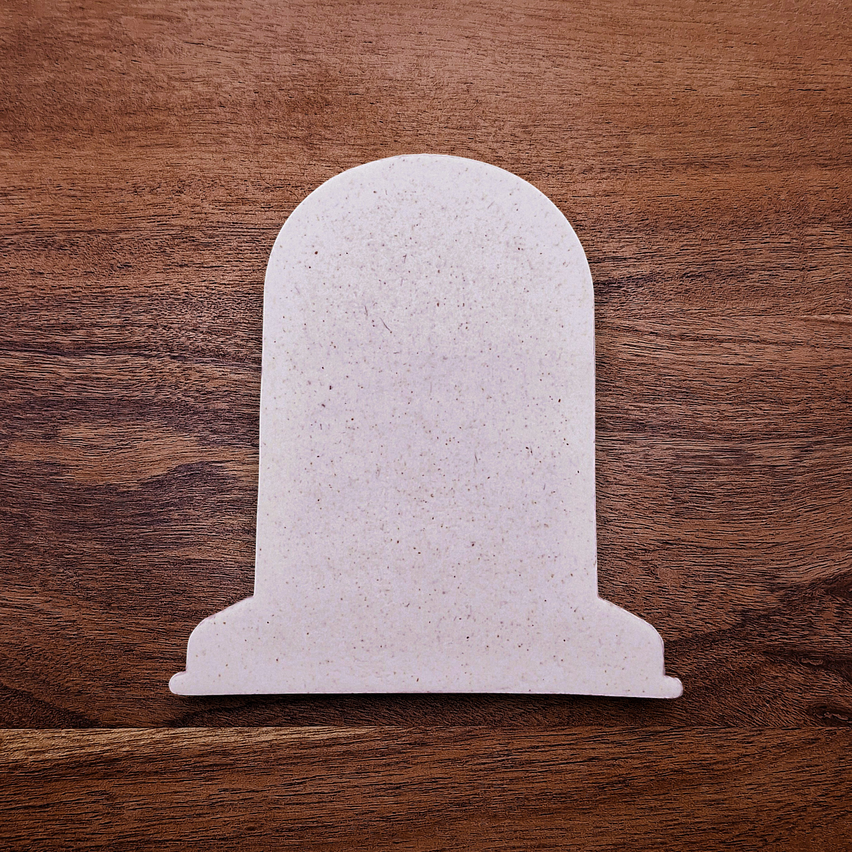 Gravestone cookie cutter cutout for Halloween cookies, fondant, and crafts, ideal for spooky baking projects and party favors.