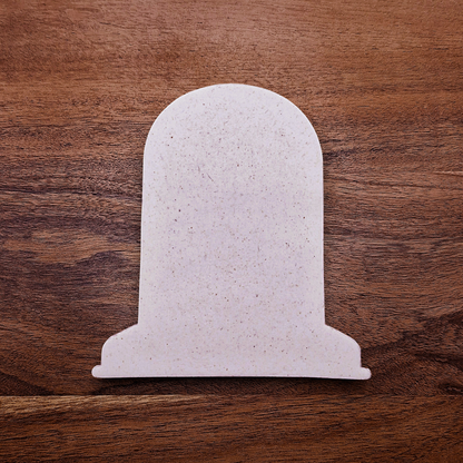 Gravestone cookie cutter cutout for Halloween cookies, fondant, and crafts, ideal for spooky baking projects and party favors.