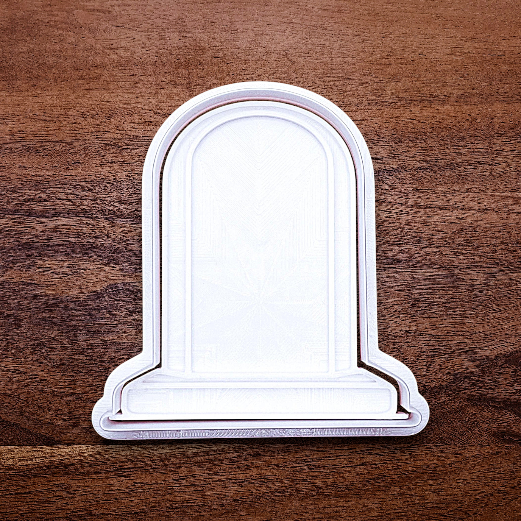 Gravestone cookie cutter with stamp for Halloween treats and spooky desserts, adds detail to dough, fondant, and craft projects.