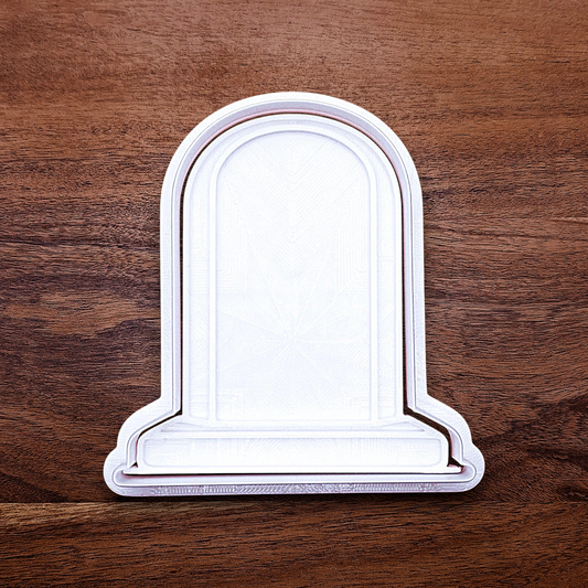 Gravestone cookie cutter with stamp for Halloween treats and spooky desserts, adds detail to dough, fondant, and craft projects.