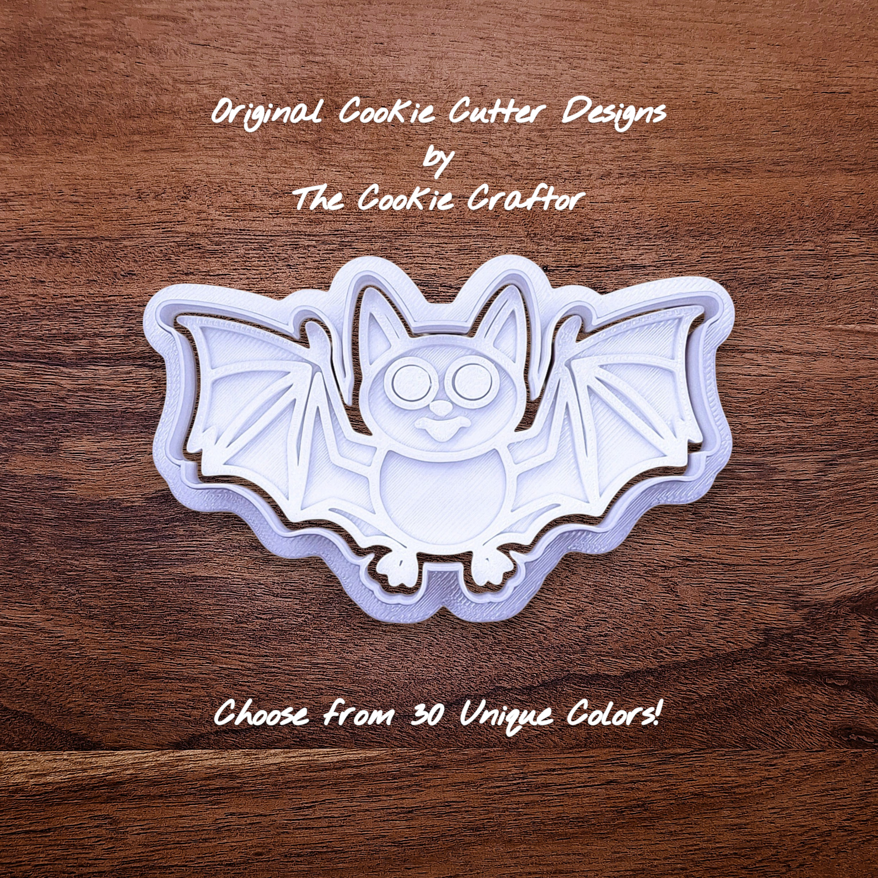 Bat cookie cutter with matching stamp, great for easy Halloween cookie decorating without icing.