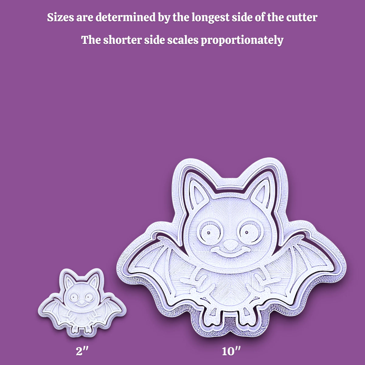 A bat-shaped cookie cutter shown in two sizes on a purple background, with text explaining that sizes are determined by the longest side and the shorter side scales proportionately. The larger cutter is labeled 10 inches and the smaller one 2 inches.