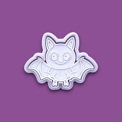 Bat cookie cutter with matching stamp, perfect for spooky Halloween cookies, fondant crafts, and gothic-themed baking projects.
