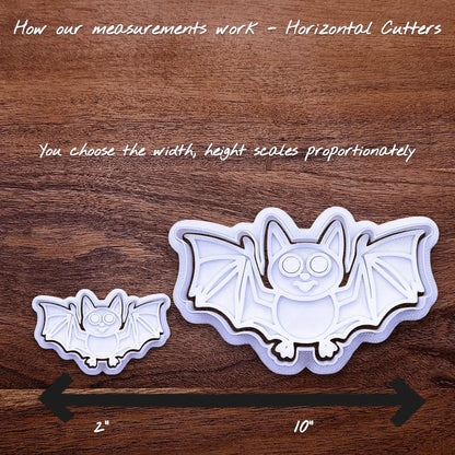 Halloween bat cookie cutters side by side to illustrate how sizing from 2 inches to 10 inches works.