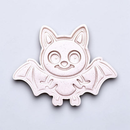 Close-up of bat cookie cutter dough imprint, perfect for spooky Halloween cookies, fondant crafts, and gothic-themed baking projects.