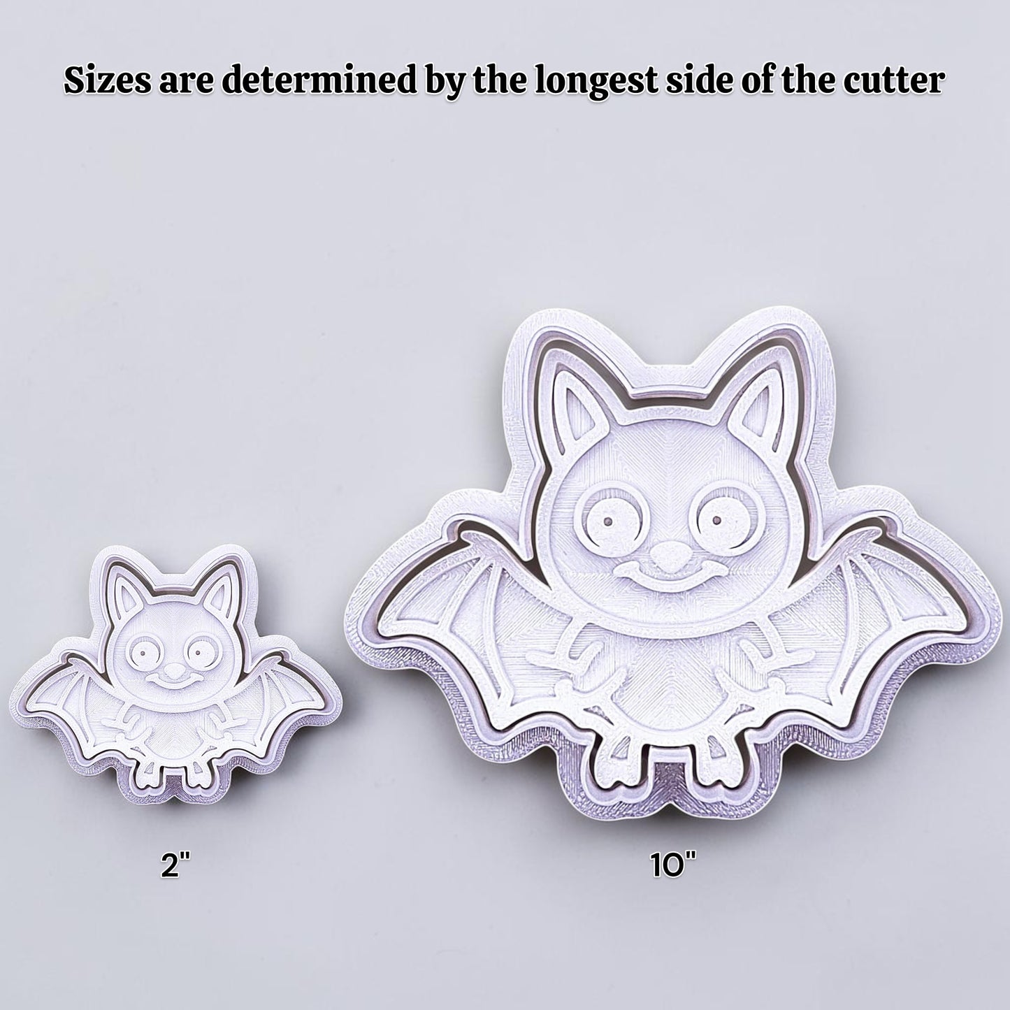 Two bat-shaped cookie cutters with sizes indicated on a light gray background, showing how size increases work.