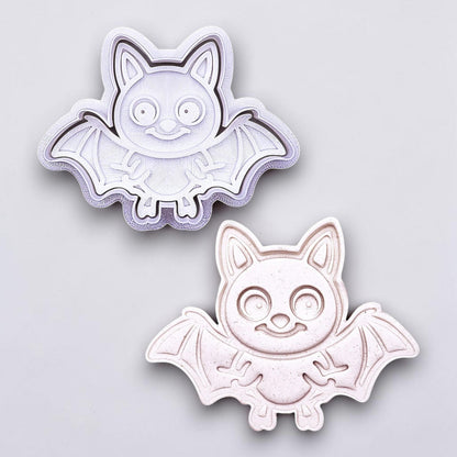 Bat cookie cutter with matching stamp and cutout, perfect for spooky Halloween cookies, fondant crafts, and gothic-themed baking projects.