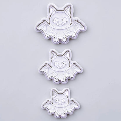 Bat cookie cutters with matching stamps, perfect for spooky Halloween cookies, fondant crafts, and gothic-themed baking projects.