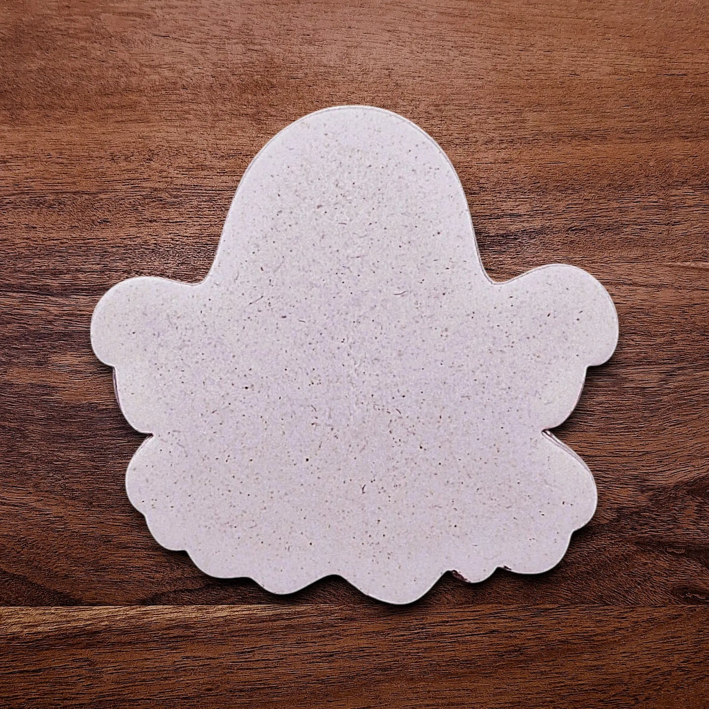 Handmade and customizable ghost cookie cutter dough imprint, great for baking Halloween trick or treats or kid-friendly spooky snacks.